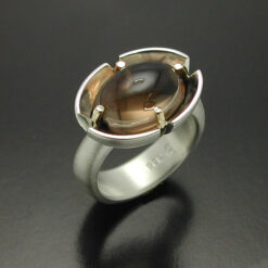 Cabochon Cut Smokey Quartz  Ring in Sterling Silver and 14kt. gold prongs.