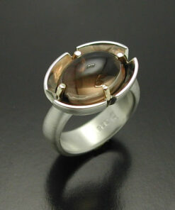 Cabochon Cut Smokey Quartz  Ring in Sterling Silver and 14kt. gold prongs.