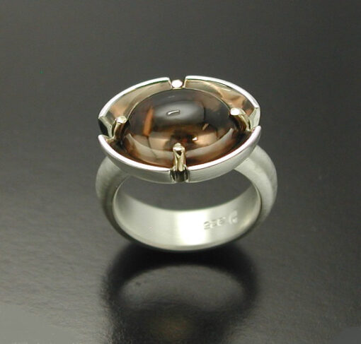 Cabochon Cut Smokey Quartz  Ring in Sterling Silver and 14kt. gold prongs.