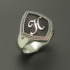 Starburst monogram ring in sterling silver with bronze background