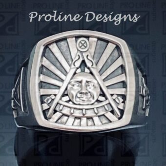 A silver ring with an image of a man 's face on it.